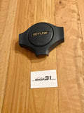 NISSAN SKYLINE R31 - 'SKYLINE' STEERING WHEEL HORN BUTTON